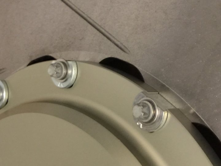 A toilet that is in a bathroom with the lid up - Pistonheads