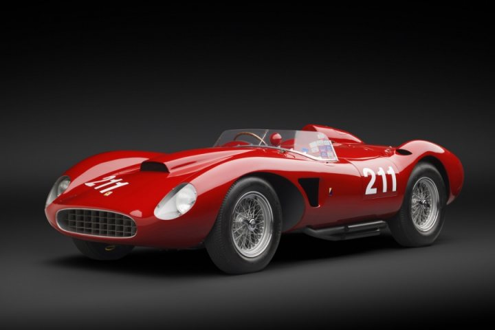 A close up of a red and black motorcycle - Pistonheads - The image features a red, vintage sports car parked on a black background. The vehicle has a prominent front grille, round headlamps, and large, extended wheel arches. The side of the car displays a race number, "211," and the good model "1," on the front wheel arch. The design includes spline-shaped wheel spokes, typical of classic sports cars, and a sloped roofline. The overall impression is that of a classic automotive collectible.