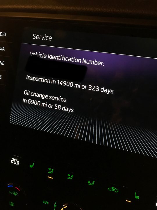 Octavia vRS 245 lease thread - Page 25 - Audi, VW, Seat & Skoda - PistonHeads - The image shows a car's dashboard displaying an "Insurance ID" with the number "1234567890". Below this, there is text indicating that there are two charges of 1800 miles each. A message at the bottom warns about a 660-mile oil change service due in 32 days or 6800 miles. The car's interior lighting is illuminated, and there are multiple screens and indicators visible on the dashboard. The vehicle appears to be parked indoors as suggested by the ambient light and the reflections on the surface below the dashboard. There is no other significant text or imagery in the photograph, making this a straightforward representation of a car's instrument cluster.
