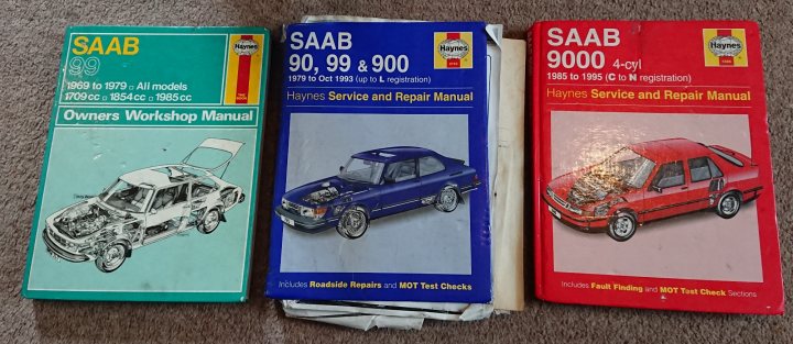A stack of books sitting on top of a table - Pistonheads