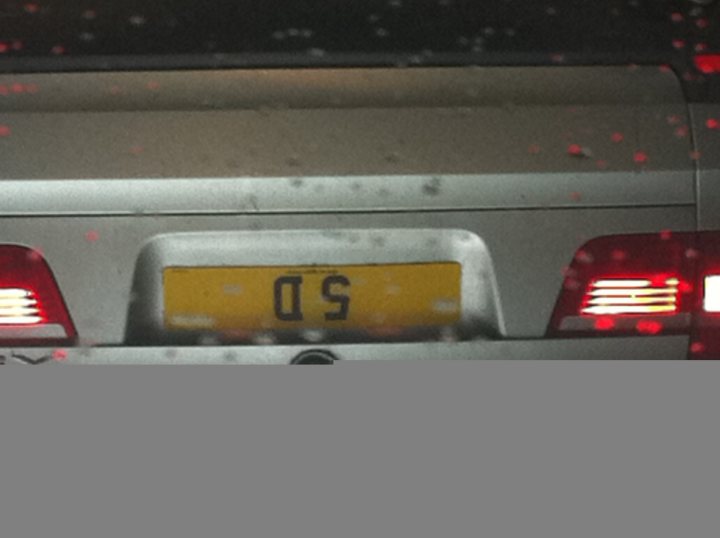 Real Good Number Plates : Vol 4 - Page 6 - General Gassing - PistonHeads - The image showcases a blurred scene of a silver vehicle, possibly a car or truck. The license plate of the vehicle is clearly visible and reads "QS." There are also two red taillights gleaming through the foggy backdrop. The entire scene has been softly edited with a sepia tone, adding to the overall dreamy and ethereal atmosphere captured in the frame. The vehicle seems to be moving, as indicated by the motion blur.