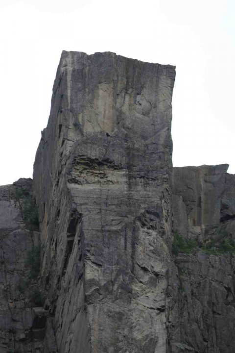 A large rock with a clock on the side of it - Pistonheads