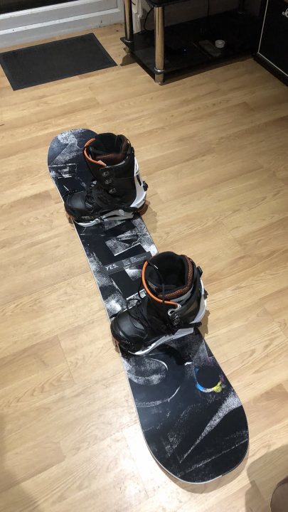 A pair of skis sitting on top of a floor - Pistonheads