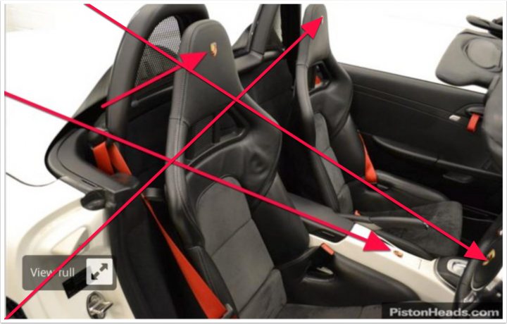 Boxster spyder advice and PDK/chrono opinions sought - Page 1 - Boxster/Cayman - PistonHeads - This image is a photograph of an interior space, specifically the driver's side and part of the passenger area of a vehicle. Red diagonal colored lines are overlaying the image, creating an X-ray or composite effect. The image likely has an instructional purpose, as the lines suggest a planned action or demonstration. The focus and lighting indicate that the photo was taken with the intention of clearly showing the backrest area of the seats, which is highlighted by the angle of the snapshot and the red lines.