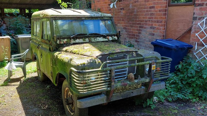 An old truck is parked on the side of the road - Pistonheads