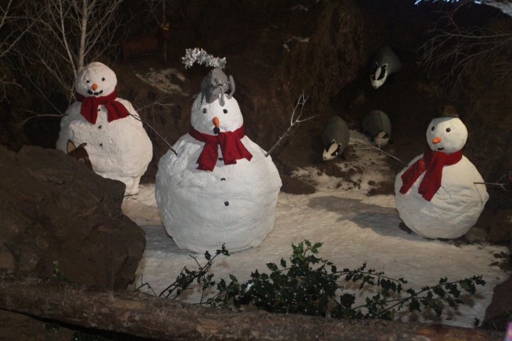 Santa in a cave  - Page 1 - South West - PistonHeads - The image showcases a creative arrangement of three snowmen on a snowy surface. Each snowman is distinct with varying sizes and adorned with accessories such as hats, scarves, and carrots for eyes and noses. They are set against a backdrop that mimics a forest with bare branches, giving a rustic feel to the scene. The snowmen seem to be positioned to pose for the camera, adding a touch of whimsy to this delightful winter scene.