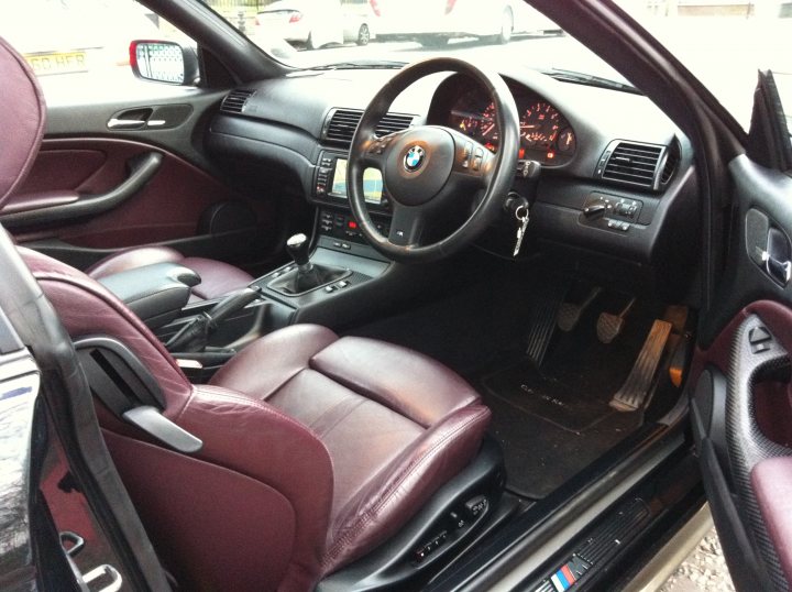 Pistonheads Bmw Coupe - This image shows the interior of a car, focusing on the driver's side with the door open. The car has a modern and luxurious design, featuring a display of a dashboard with various controls and a panel of gauges visible in the background. The front driver's seat is situated within the frame and appears to be upholstered in leather. A steering wheel, adorned with the BMW logo, is centered in the car's cockpit. Additionally, one can spot a pair of doors on the side, signifying a four-door configuration. The specific model of the car is not identifiable in the image.