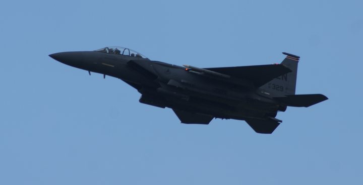 Post amazingly cool pictures of aircraft (Volume 2) - Page 203 - Boats, Planes & Trains - PistonHeads - The image captures a scene of a military jet at high altitude,either preparing for landing or completing an airshow stunt. The plane, viewed from below, dominates the frame, its sleek fuselage stretching across the vast expanse of the clear blue sky. The dark-colored body contrasts with the bright backdrop, highlighting its impressive vertical stabilizer. The absence of clouds and the apparent solitude lend a sense of freedom and control, synonymous with the world of aviation.