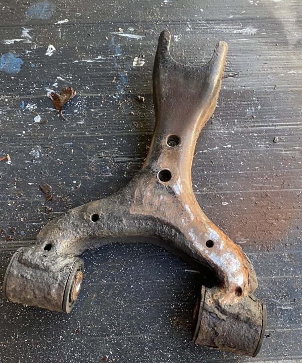 A pair of rusted scissors sitting on top of a wooden table - Pistonheads