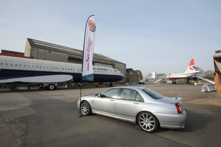 A large white airplane sitting on top of a tarmac - Pistonheads