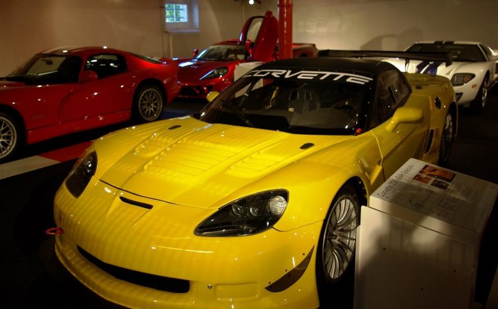 Nice Pistonheads Place Vettes - The image showcases a spacious museum featuring three distinct sports cars. Dominating the foreground, a striking yellow and black Corvette, meticulously polished, draws the viewer's attention. To its left, red in color, a sports car contrary to the Corvette, adds a pop of vibrant red to the scene. On the opposite side, slightly in the background, is a white Lamborghini, its sleek design in stark contrast to the kinetic energy of the other cars. A silent observant scrutinizes these vehicles from the top left corner of the image, casting a soft light that accentuates the shiny exteriors of these machines.