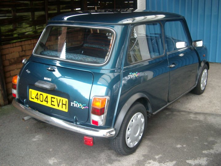 Lets see a picture of your classic(s) - Page 11 - Classic Cars and Yesterday's Heroes - PistonHeads - The image features a small blue car parked in an indoor garage or storage area. The car has a distinctive design, with a large rear window and a contrasting yellow license plate. There is a black emblem with white text on the trunk hatch that reads "RIO". The car appears to be compact with a two-door configuration and has a RI valve on the rear wheel. The setting suggests casual use and storage, given the licence plate "L404 EVH" which may indicate registration details or a specific group or context associated with the car, possibly a music enthusiast reference as 'EVH' might stand for Ed, The Van Halen Brother, known for their famous band Van Halen, where 'EVH' is short for Eddie Van Halen.