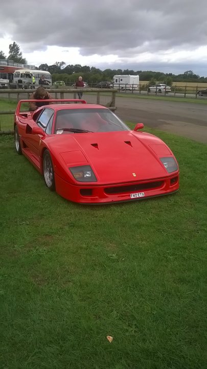 Classic Ferrari at Croft today. - Page 1 - Ferrari Classics - PistonHeads - The image features an unmistakable Ferrari, a bastion of luxury and speed, parked on a lush green field. The car, painted in a vibrant shade of red, is facing the camera, showcasing its sleek design and glossy finish. Limited information is available regarding the Ferrari's location or surroundings, but its prominence and the fresh, inviting grass suggest a setting of tranquility, perhaps away from the hustle and bustle of city life. One key piece of text that stands out is the word "Casio", which is visible as an item near the headlights of the Ferrari, hinting at a possible connection between the sportscar and the well-known watch brand.