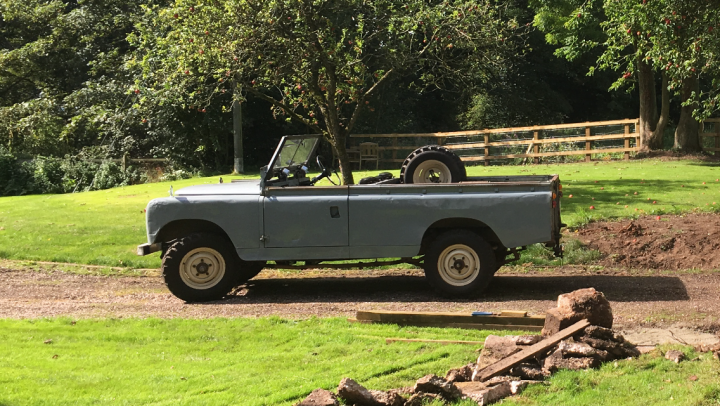 Pickup Trucks - Chav Vehicle of Choice - Page 4 - General Gassing - PistonHeads - The image showcases a vintage vehicle, specifically an old-fashioned truck, parked on what appears to be a grassy field. The truck is positioned atop a set of rocks, creating a makeshift elevation. The area surrounding the truck seems to have been recently excavated or dug up, as suggested by the presence of dirt and rocks in the vicinity. The scene exudes a sense of nostalgia due to the vintage nature of the vehicle and the informal outdoor setting.