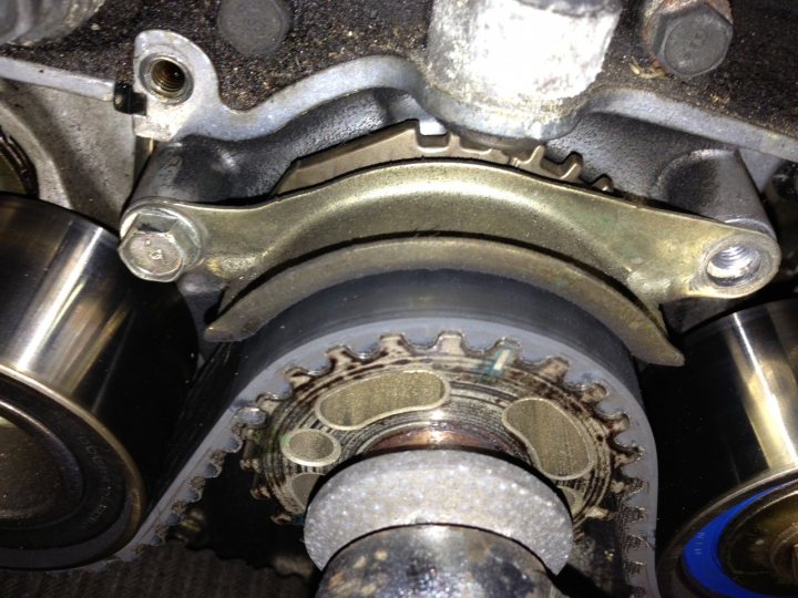 A close up of a red and black motorcycle - Pistonheads - The image provides a detailed view of the undercarriage of a vehicle. The main focus is a gearbox component with multiple teeth and a metal surface that gives the impression of strength and durability. The gearbox is made of metal, suggesting it's designed for heavy-duty use. The gearbox is surrounded by various other engine components, indicating that this is a complex piece of machinery. Although there are no texts visible in the image, the image is rich in detail, providing a clear view of a fundamental part of a vehicle's drivetrain.