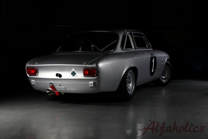 A car is parked in front of a parking meter - Pistonheads - The image presents a classic car, its body painted in a sleek silver finish that glistens under the ambient light. The car is seen from a side angle, emphasizing its streamlined design and elegance. It's stationed in an indoor setting, likely a garage or showroom floor, which adds a sense of cleanliness and protection to the scene. The lighting in the photo is soft and atmospheric, further accentuating the car's details and giving it a vintage feel.