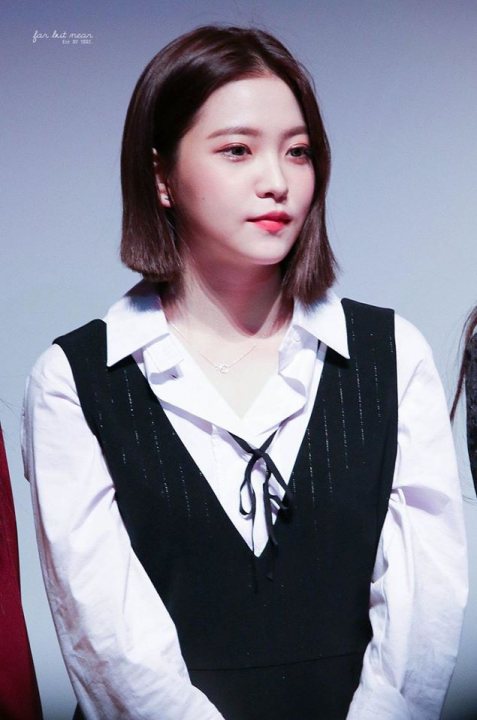 A woman in a dress shirt and tie