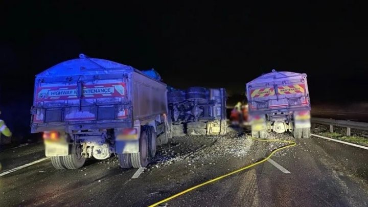 M1 crash this morning. Three HGVs... - Page 1 - General Gassing - PistonHeads UK - The image shows a nighttime scene of an accident involving two trucks on what appears to be a rural road. The vehicles are heavily damaged, with visible scratches and debris. Emergency services such as fire trucks are present, suggesting that they have arrived at the site of the accident. The sky is dark, indicating it's late evening or nighttime. There are no people visibly in the image, focusing attention on the aftermath of the collision.