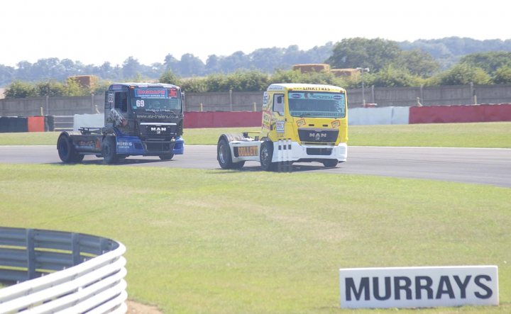 A group of trucks are parked in a field - Pistonheads
