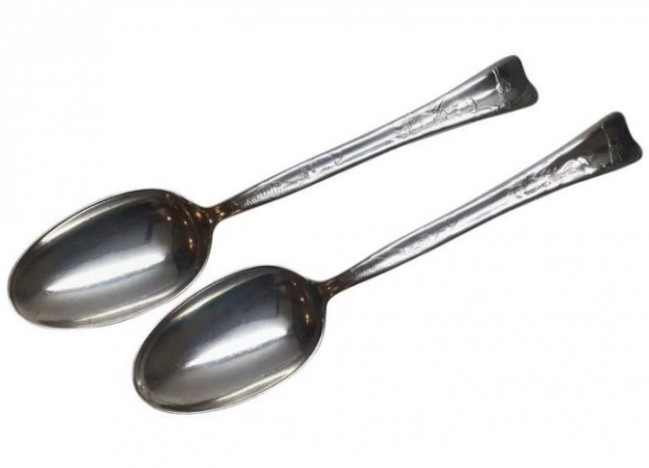 New Teaspoon Advice Please - Page 54 - The Lounge - PistonHeads - The image features two spoon-like objects placed side by side against a white background. These objects are metallic, possibly made of silver or another reflective material. They have long handles and large bowl sections. One end of each object appears to be a spoon head with a rounded tip, designed for scooping. The other end resembles the back end of a spoon, complete with what seems to be a small handle attached to a larger one that has a hole in the center for hanging or placing on a stand. The overall style of the image is simple and clear, likely intended for illustrative or catalog purposes.