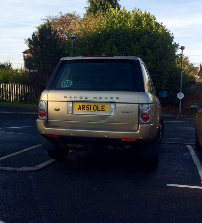 Real Good Number Plates : Vol 4 - Page 223 - General Gassing - PistonHeads - In the image, a gold Range Rover is parked in a parking lot. The car, prominently bearing a license plate that reads "AR51 OLE", stands out against the background of a well-lit, outdoor setting. A headlight and a tail light can be seen on the vehicle. Nearby, there are trees and buildings, adding to the suburban atmosphere of the scene.