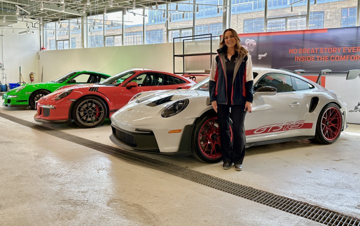 New RS added to garage - Page 1 - Readers' Cars - PistonHeads UK - The image captures an indoor setting, specifically a showroom or garage filled with luxury cars. There are four sports cars in total, each exhibiting different colors and models, reflecting the variety of the collection. The cars are parked neatly on what appears to be a specialized flooring that is suitable for such high-end vehicles.

In the foreground, there is a person standing amidst the showcased cars. This individual seems to be a visitor or possibly an employee at this establishment. They are dressed in casual attire and are facing the camera, looking directly at the viewer. Their presence adds a human element to the scene, suggesting that people visit and interact with these vehicles.

The background reveals more of the showroom's interior. It includes additional elements such as a window allowing natural light to filter in, reinforcing the idea that this space is designed to display and sell luxury automobiles. Overall, the image portrays an upscale environment where visitors can appreciate and potentially purchase high-end sports cars.