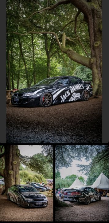 Vt2 on the bay  - Page 1 - HSV & Monaro - PistonHeads UK - The image is a collage of three photographs featuring different views of the same car. The main photograph in the center shows a dark-colored sports car parked on a grassy area, with the tree line just behind it. The side angle shows the car's sleek design and the license plate is visible, reading "DAKOTA." The third photo captures the car from an overhead perspective, emphasizing its low and wide stance. The image seems to be showcasing the car in a unique outdoor setting, possibly at a car show or event.