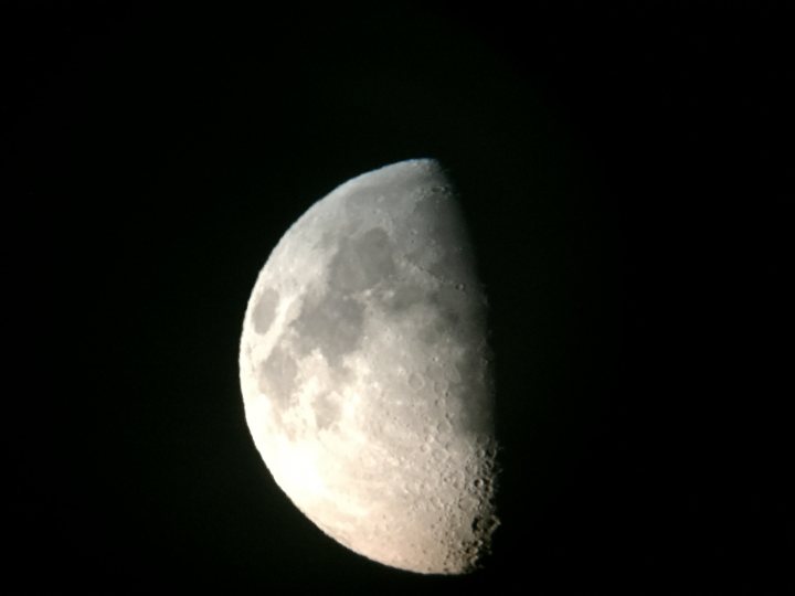 Webcam Astrophotography  - Page 1 - Science! - PistonHeads - The image shows a large, illuminated moon against a dark sky. The moon is waxing gibbous and is showing a significant portion of its surface, with various shades of gray, white, and black. The background is abide the moon, enhancing the prominence of the moon itself. There are no visible texts or distinguishing marks on the moon. The style of the image is a photograph or a digitally processed image, presented in the evening sky.