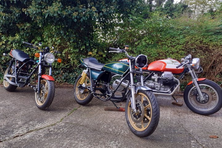 A group of motorcycles parked in a field - Pistonheads