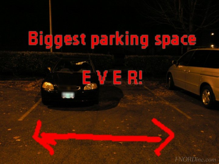 Muppets Pistonheads Park - The image displays a nighttime scene with several vehicles parked in a parking lot. At the center of the image, one of the cars is highlighted by a red overlay with arrows pointing towards it. Over this highlighted car, there is text that reads "Biggest parking space EVER!" accompanied by two red exclamation marks. The overlay seems to emphasize the spaciousness of the parking area. The setting outside looks like a foggy night, indicated by a vapor trail and lit spaces in the background.