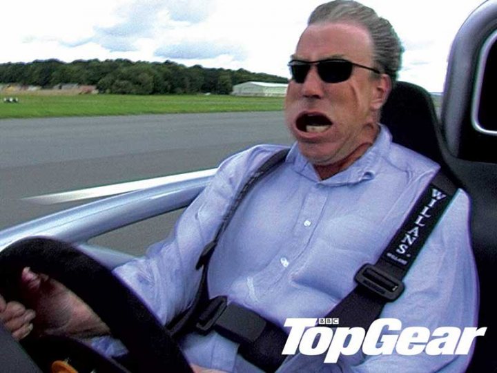 Mugen Atom Ariels Pistonheads - The image is a still from a video, likely taken during a car race given the person's attire and the setting. The man is seated in the driver's seat of a race car and appears to be reacting strongly, possibly in the midst of a high-speed action. He is wearing, among other things, a blue shirt, black sunglasses, and a racing suit with a harness. The car's performance seems erratic as indicated by the man's unusual facial expression. In the lower right corner of the image, the words "TOPGEAR" are visible, suggesting that the image may have been associated with the popular automotive magazine or website.