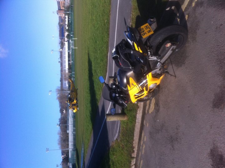 A motorcycle is parked on the side of the road - Pistonheads