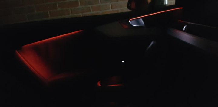 The S5 lease thread - Page 29 - Audi, VW, Seat & Skoda - PistonHeads - The image captures the interior of a car, taken from the perspective of the passenger. The emphasis is on the driver's side, illuminated by a red light that casts a glow on the side seat. The steering wheel and gear shift are visible, with their details highlighted by the light. The back of the front seat is also part of the frame, suggesting the car's seating arrangement. The image exudes an atmospheric vibe, possibly late night or in a dimly lit environment.