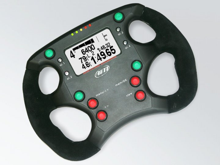 Formula Pistonheads Wheel Aim - This image shows a four-point steering wheel less some plastic components that allow you to fit into a car or yours. The wheels are black with green accents, and it features multiple buttons and digital displays, indicative of advanced functions or controls frequently found in luxury or sports vehicles. The brand 'AUS' is prominently displayed, suggesting the manufacturer of the steering wheel. The steering wheel is equipped with a substantial array of buttons and a display that seems to show "620", "79.2", and "149.6", though the context of these figures is unclear from the image alone. The main focus of the image is to highlight the steering wheel, with its design and features being the central subjects.