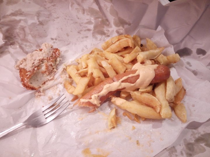 A plate of food with a sandwich and french fries