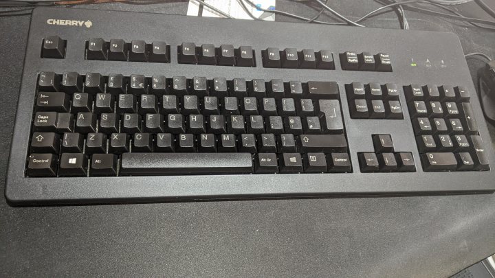 A close up of a keyboard and a mouse - Pistonheads