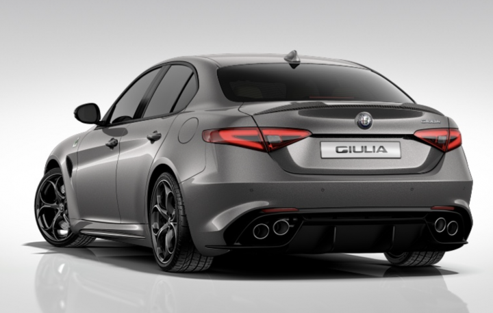 RE: Alfa Romeo Giulia Veloce: Driven - Page 4 - General Gassing - PistonHeads - The image showcases a stylish, gray Alfa Romeo car. The car is positioned at a three-quarter angle, allowing a clear view of its sleek design. The color is a two-tone gray, giving it a modern and elegant look. Additional details such as red taillights and a license plate labeled "Alfa Romeo" and "Giloria" further enhance the car's distinct identity. The tire wells and rims are also obscured, suggesting a clean and uncluttered design approach commonly associated with luxury vehicles. The car appears to be well-maintained with no visible signs of wear.