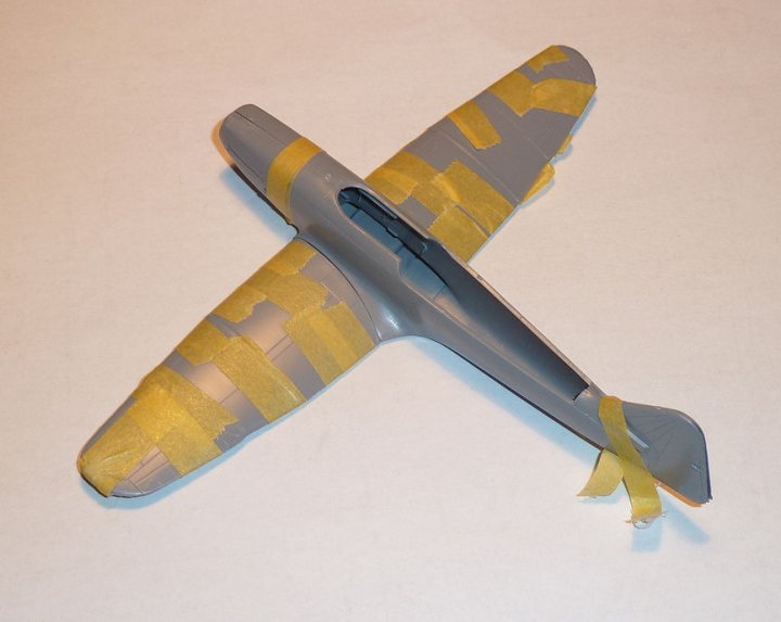 A close up of a pair of scissors - Pistonheads - The image features a toy model of a Sea Harrier fighter jet, a two-dimensional representation of a military plane, captured in its closed position. The plane's designers employed a color scheme that includes yellow and gray, suggesting it's designed to resemble a bird's head, perhaps to emphasize its agility or the "hawk-eye" elements of flight. The yellow tape across the body of the toy plane adds a pop of color and a playful, child-friendly aesthetic to the model. The entire model is placed against a white background, giving it a clean and uncluttered look, perfect for display.