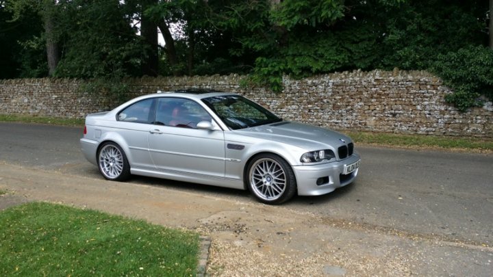 The car you miss the most - Page 2 - General Gassing - PistonHeads - The image showcases a silver-colored BMW car parked on a gravel driveway. The BMW is one of the most popular luxury car brands worldwide. It is positioned next to a light wall or fence with a stamped brick pattern, indicating a well-maintained property. The lush green lawn and sparse trees suggest a peaceful suburban setting. The car's position on the driveway indicates it might be a frequently used vehicle in the household, reflecting the owner's taste for luxury.