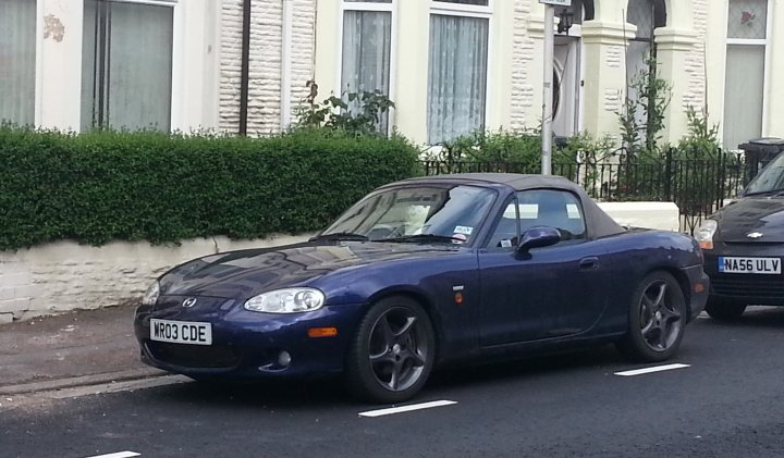 A car parked in a parking lot next to a car - Pistonheads