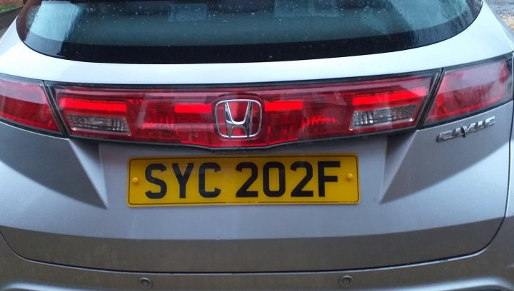 What private plates do you have? - Page 68 - General Gassing - PistonHeads UK - The image features a silver Honda Accord parked on a street. The vehicle is positioned at an angle that gives a clear view of the back and left side. The car has a license plate and appears to be stationary, possibly waiting in traffic or parked for the moment. There are no other vehicles or objects in close proximity to the car, suggesting a quieter section of the street.