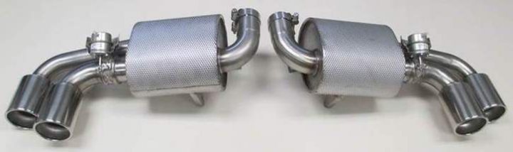 A row of urinals mounted to a wall - Pistonheads - The image shows a set of car exhaust pipes laid out on a flat surface. There are two main metal pipes, one with a bend and both with flanges on each end. These pieces appear to be from a vehicle's exhaust system, likely for a truck or a large saloon car based on the size. The metal pipes are metallic and have a slight sheen, suggesting they are of high quality. The pipes are positioned parallel to each other, with the bended pipe on the left and the straight one on the right.