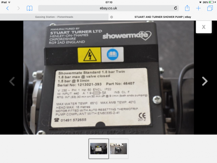 Running two showers from one pump? - Page 2 - Homes, Gardens and DIY - PistonHeads - The image selected shows a close-up of a shower pump, possibly an electric water pump. The pump is made by a company named Stuart Turner, based in OXFORDSHIRE, RG 9 2AD ENGLAND. The photo has a high zoom-in, focusing on a yellow label with various specifications including serial numbers, voltage information, and heating safety warnings. The interface suggests a mobile device displaying the product detail page, with a barcode and a call-to-action button. The photo appears to have been taken from a smartphone using a camera app, which is why there is a thumbnail of an image taken at 7:10. The surrounding area is not in focus, emphasizing the product.