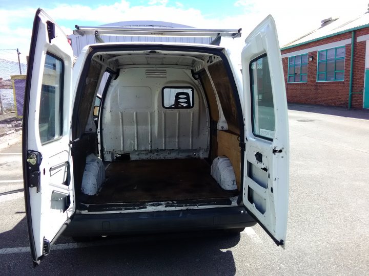 A truck with a camper on the back