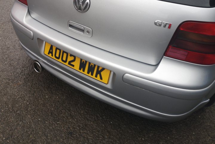 Golf MK4 1.8t - Page 21 - Readers' Cars - PistonHeads - The image shows a silver Volkswagen car parked on a street. The vehicle has a European license plate with the letters "A02 WK" visible. It appears to be an older model, and there are some decals or stickers on the windows. The car is positioned at an angle, with its front right side facing the viewer. There's a clear sky in the background, suggesting that it might be a bright day. The street where the car is parked seems quiet, with no other vehicles immediately visible.