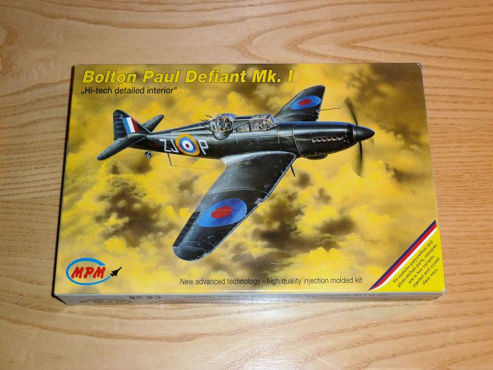 A close up of a plane flying in the sky - Pistonheads - The image features the cover of a Bolton Paul Defiant Mk. I model kit, presented in eye-catching packaging. The cover art depicts the Vietnam War heavily populated with Royal Air Force Defiant Mk. I helicopters, painted in vivid brown, red, and blue colors. These aircraft, equipped with rotors, are displayed against a dramatic sky adorned with clouds and distant storm clouds. Below the main image, there are texts and logos that provide information about the model kit and the company manufucturing it.