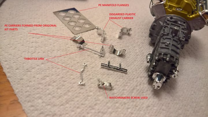 FORD GT40 MKII 1/12TH TRUMPETER - Page 1 - Scale Models - PistonHeads - The image shows a disassembled object, which appears to be an electronic device or appliance, laid out on a white surface. Various components are scattered around, indicating that it has been taken apart for maintenance or repair. There's a clear focus on the internal structure of the device, highlighting its complexity and the intricate nature of its parts. The background is indistinct, keeping the attention solely on the disassembled object.