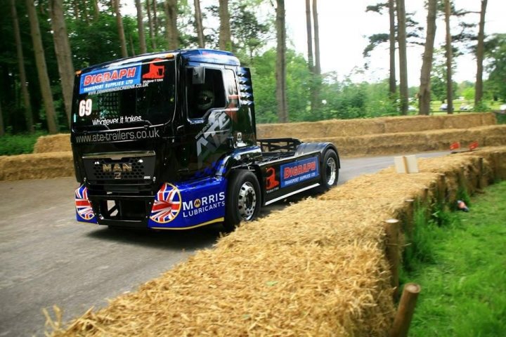 A large semi truck driving down a dirt road - Pistonheads
