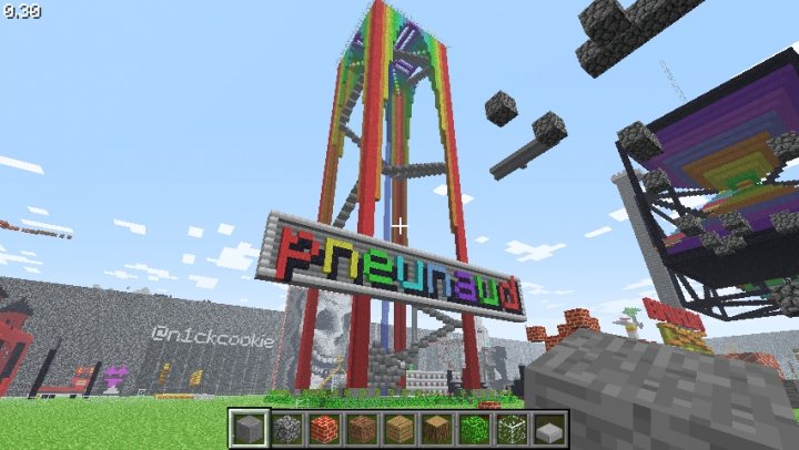 Rainbowfalljpg - The image showcases a vibrant and detailed scene from a Minecraft-like game, with a variety of structures and objects. At the center stands a large, colorful carousel, adding a fun and whimsical touch to the scene. The sky is a clear blue, interrupted by a few clouds. The environment below is filled with green grass, providing a stark contrast to the towering structures. Several high structures, possibly like roller coasters, dot the landscape, reaching for the sky. The scene is filled with life and color, suggesting a bustling and active gaming environment.