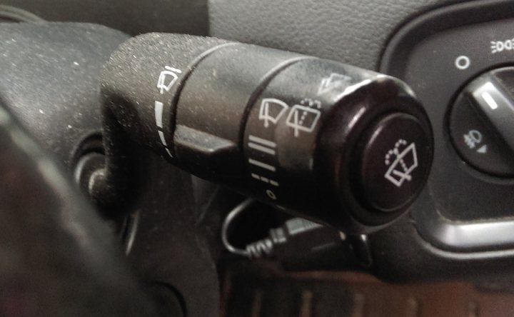 A close up of a nintendo wii game system - Pistonheads - The image captures a close-up view of a car center console, focusing on the multimedia control knob in the foreground. The knob displays icons that likely represent music, navigation, contact list, and possibly other functions or settings. The background, though blurred, suggests the image was taken inside a vehicle with the camera positioned close to the console. The overall scene conveys a sense of music or multimedia engagement, given the prominent placement of the control knob.